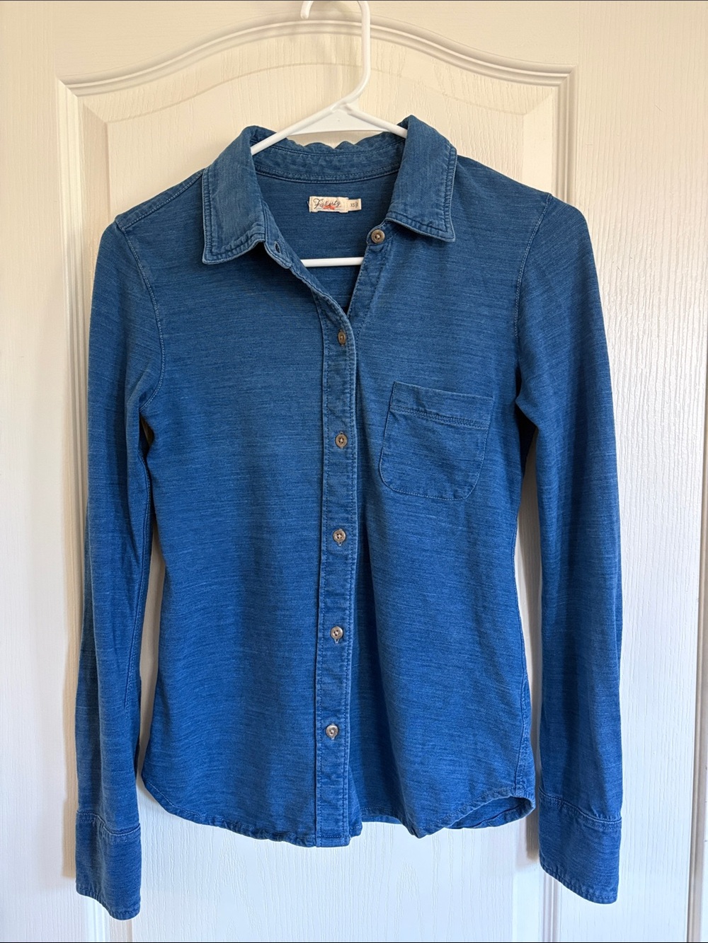 Faherty knit long sleeve button up shirt in blue.